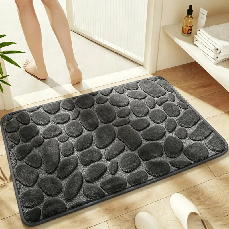 Alfombra de baño de franela con relieve de guijarros